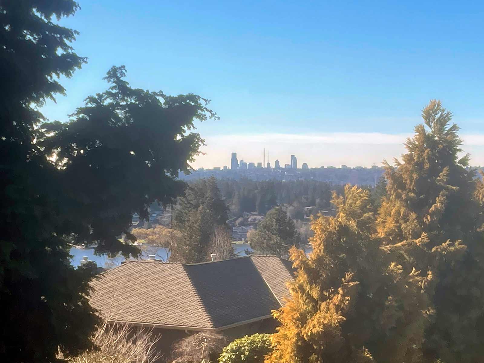 Kirkland neighborhood of Central Houghton of residential street with view of Seattle and Lake Washington f